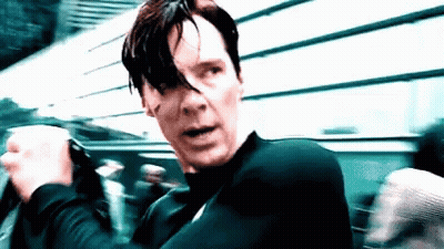 A Close Up Of A Man 'S Face With A Black Shirt On GIF