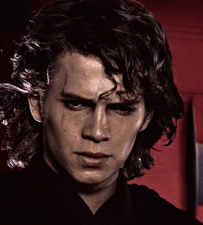 A Close Up Of A Man 'S Face With A Black Shirt GIF