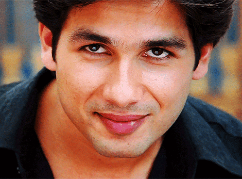 A Close Up Of A Man 'S Face With A Black Shirt GIF