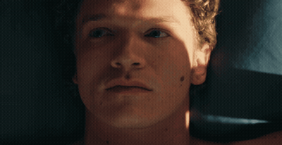 A Close Up Of A Man 'S Face With A Black Spot On His Face GIF