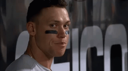 A Close Up Of A Man 'S Face With A Black Stripe On His Face . GIF