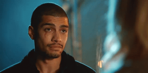 A Close Up Of A Man 'S Face With A Bloody Eye GIF