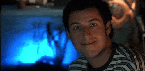 A Close Up Of A Man 'S Face With A Blue Background GIF