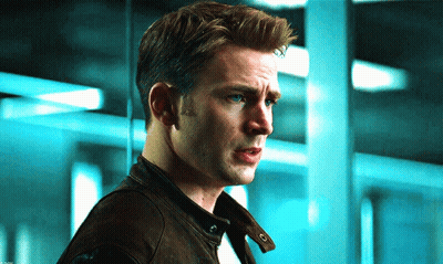 A Close Up Of A Man 'S Face With A Blue Background GIF