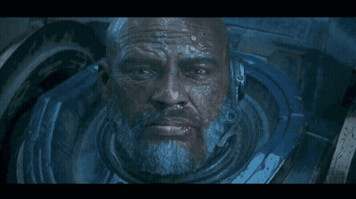 A Close Up Of A Man 'S Face With A Blue Helmet GIF