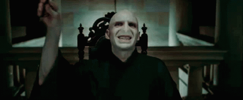 A Close Up Of A Man 'S Face With A Blue Light Coming Out Of His Eyes GIF