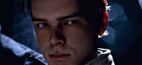A Close Up Of A Man 'S Face With A Blue Light Coming Out Of It GIF