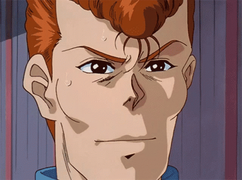 A Close Up Of A Man 'S Face With A Blue Shirt On GIF