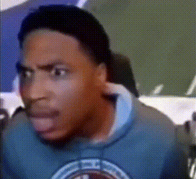 A Close Up Of A Man 'S Face With A Blue Shirt That Says ' Chicago ' On It GIF