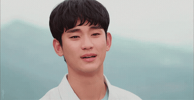 A Close Up Of A Man 'S Face With A Blue Sky Behind Him GIF