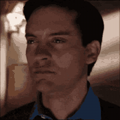 A Close Up Of A Man 'S Face With A Blurred Background GIF