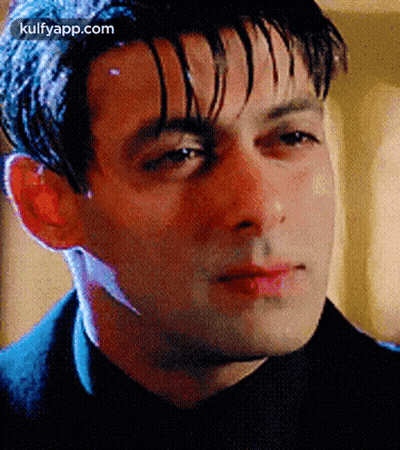 A Close Up Of A Man 'S Face With A Blurred Background . GIF