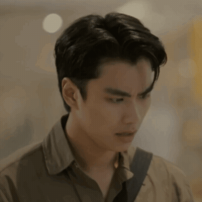 A Close Up Of A Man 'S Face With A Blurred Background And A Shoulder Strap . GIF