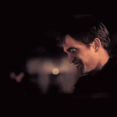 A Close Up Of A Man 'S Face With A Blurred Background GIF