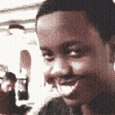 A Close Up Of A Man 'S Face With A Blurred Background GIF