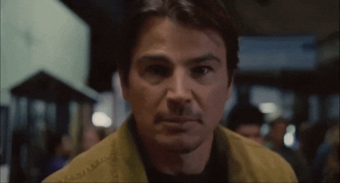 A Close Up Of A Man 'S Face With A Blurred Background GIF