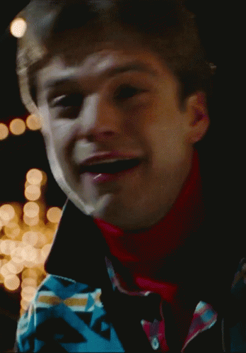 A Close Up Of A Man 'S Face With A Blurred Background GIF
