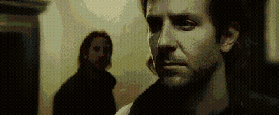 A Close Up Of A Man 'S Face With A Blurred Background GIF