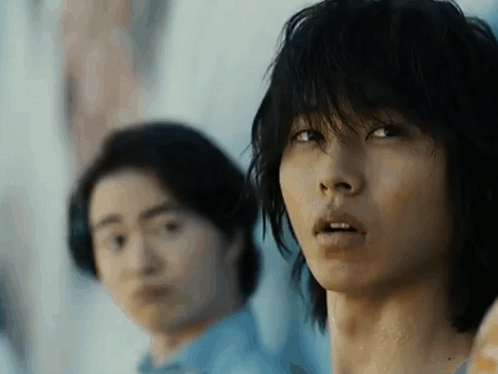 A Close Up Of A Man 'S Face With A Blurry Background . GIF