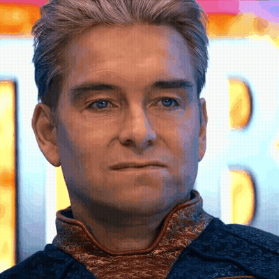 A Close Up Of A Man 'S Face With A Blurry Background GIF