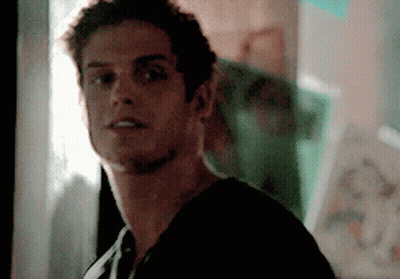 A Close Up Of A Man 'S Face With A Blurry Background GIF