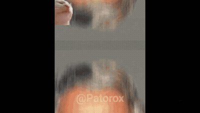 A Close Up Of A Man 'S Face With A Cat 'S Head On His Forehead . GIF
