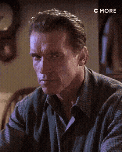 A Close Up Of A Man 'S Face With A Clock In The Background And The Word C More Below Him GIF