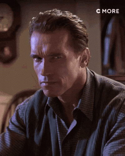 A Close Up Of A Man 'S Face With A Clock In The Background And The Words C More Below Him GIF