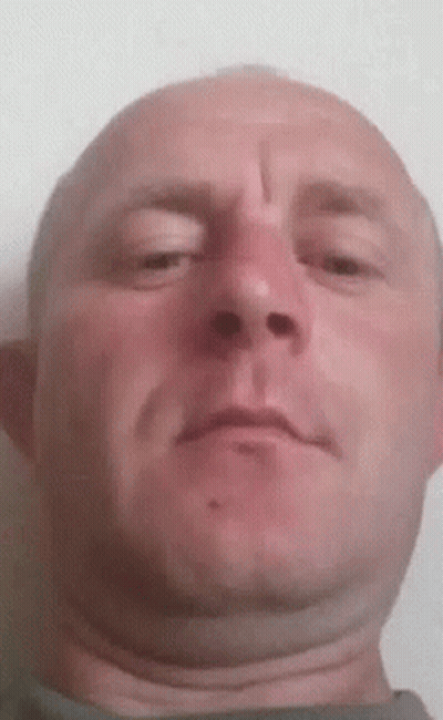 A Close Up Of A Man 'S Face With A Cross On His Forehead GIF