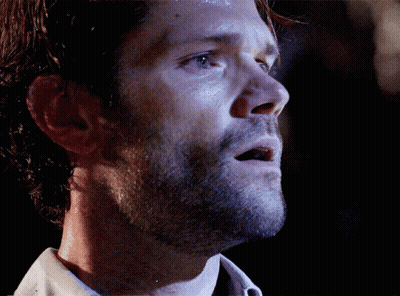 A Close Up Of A Man 'S Face With A Dark Background GIF