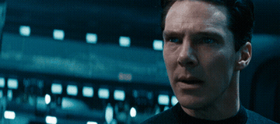 A Close Up Of A Man 'S Face With A Dark Background GIF
