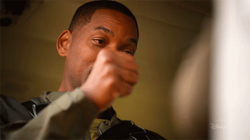 A Close Up Of A Man 'S Face With A Disney Logo On The Bottom Right GIF