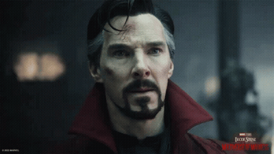 A Close Up Of A Man 'S Face With A Doctor Strange Logo In The Background GIF