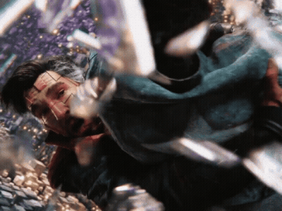 A Close Up Of A Man 'S Face With A Few Pieces Of Glass Behind Him GIF