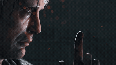 A Close Up Of A Man 'S Face With A Finger Pointing Up GIF