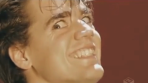 A Close Up Of A Man 'S Face With A Funny Face . GIF