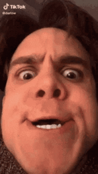 A Close Up Of A Man 'S Face With A Funny Face . GIF