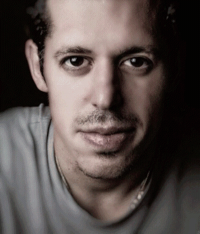 A Close Up Of A Man 'S Face With A Gray Shirt GIF