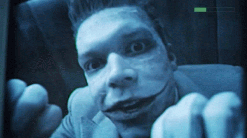 A Close Up Of A Man 'S Face With A Green Arrow Pointing To The Right GIF