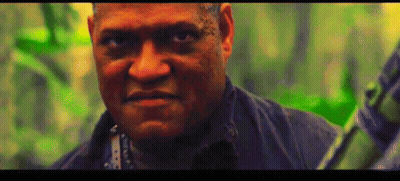 A Close Up Of A Man 'S Face With A Green Background Behind Him GIF
