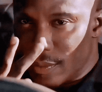 A Close Up Of A Man 'S Face With A Hand Covering His Nose GIF