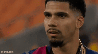 A Close Up Of A Man 'S Face With A Hand On His Face . GIF