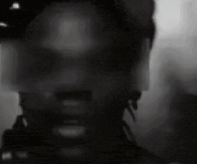 A Close Up Of A Man 'S Face With A Hat On . GIF