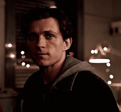 A Close Up Of A Man 'S Face With A Hoodie On GIF