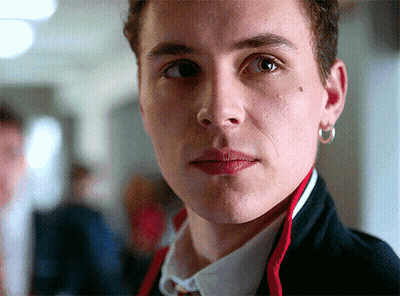 A Close Up Of A Man 'S Face With A Hoop Earring On His Left Ear GIF
