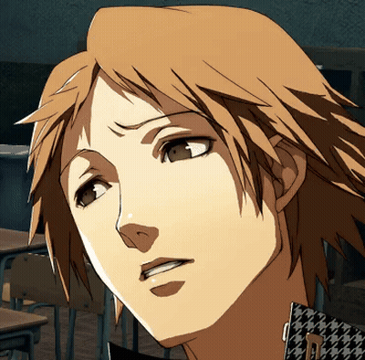 A Close Up Of A Man 'S Face With A Houndstooth Shirt On GIF