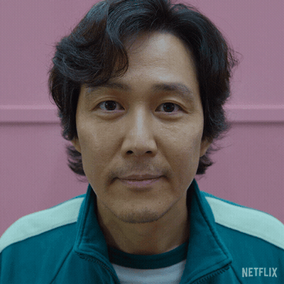 A Close Up Of A Man 'S Face With A Jacket That Says Netflix On It GIF