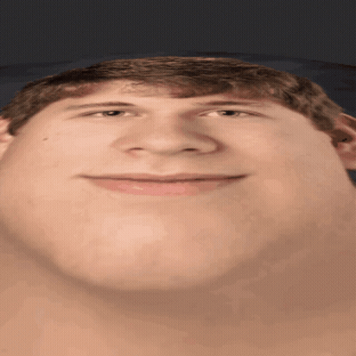 a close up of a man 's face with a large chin
