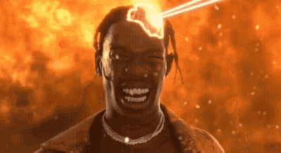 A Close Up Of A Man 'S Face With A Light Coming From His Head . GIF