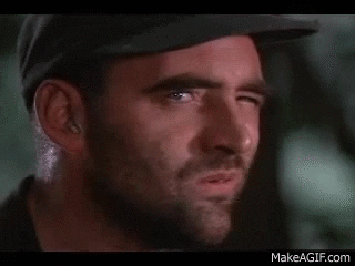 A Close Up Of A Man 'S Face With A Missing Tooth . GIF